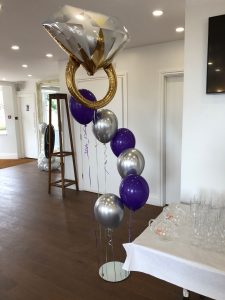 Spiral of floating wedding balloons with ring